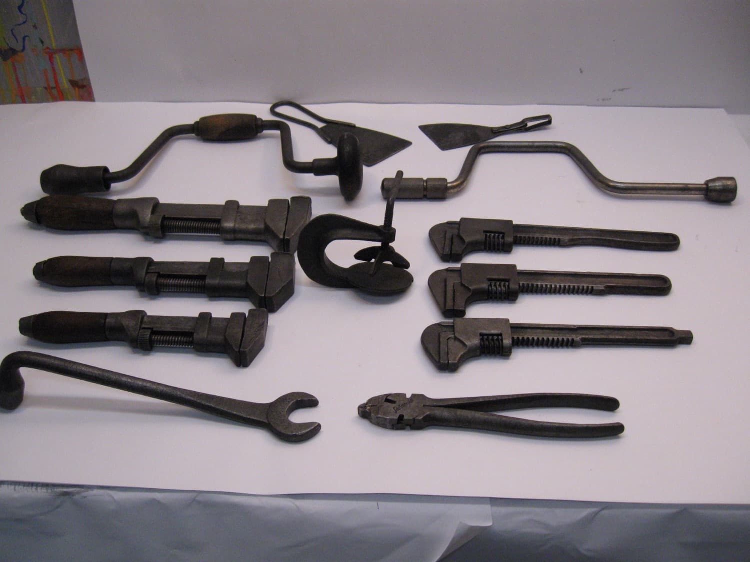 Vintage hand tools arranged in a flat-lay on a workbench