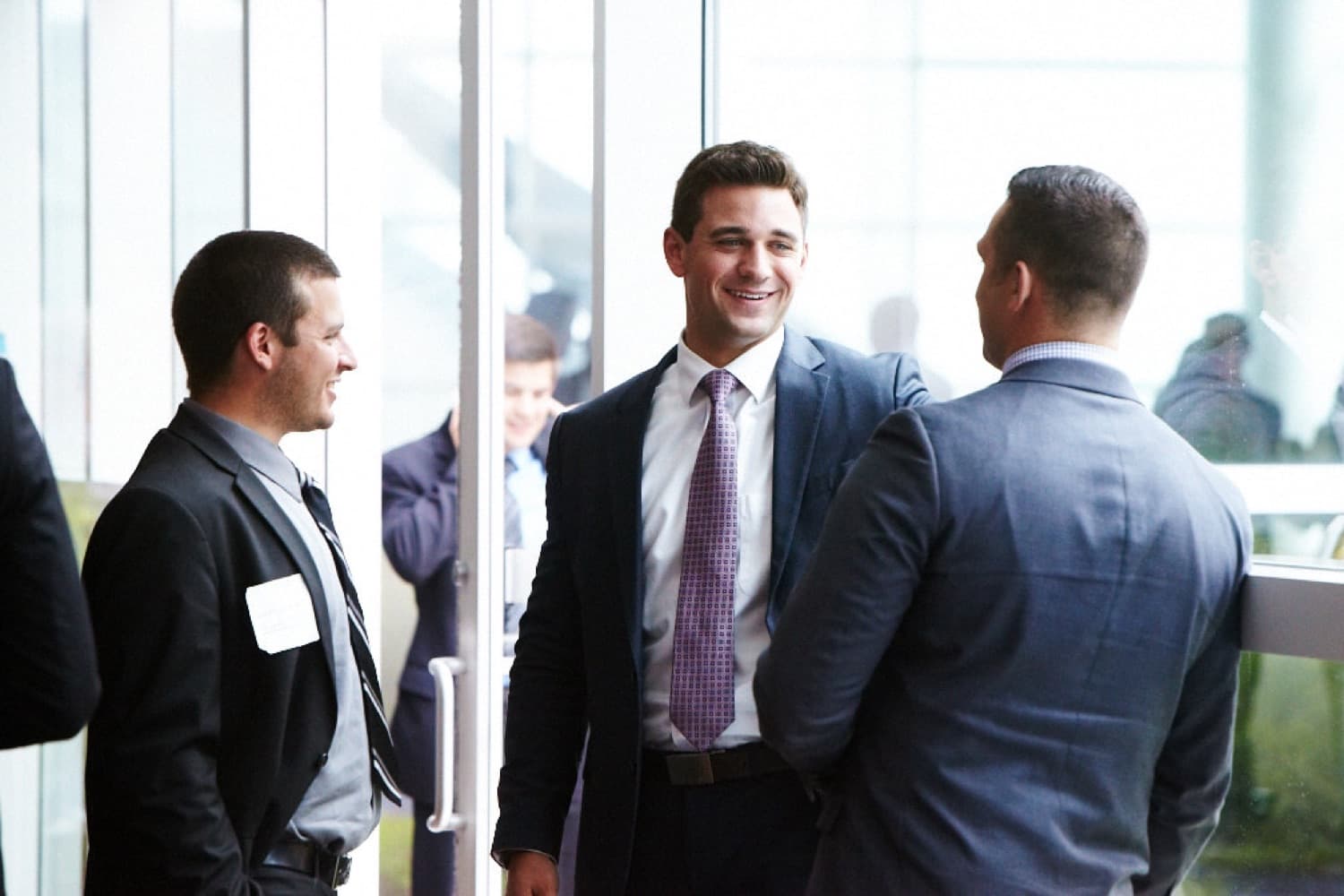 Cedarline Financial — three professionals talking in a bright office